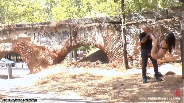 Bare boobs brunette slave Carol Vega with leather mask on her head gets walked on the public streets then spanked and fucked in different places by Omar Galanti 