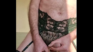 Man dressed in luxurious lingerie and mastubates and spooges on golden sandals  