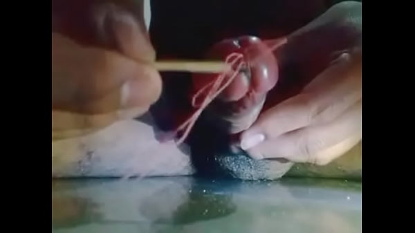 Insert stick in penis and getting wet