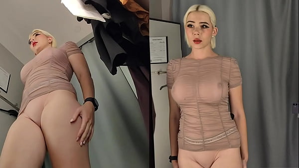Naked girl try on haul clothes in a shopping mall. Amateur with big tits  