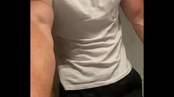 Young stud teasing with his hard cock while wearing sweatpants