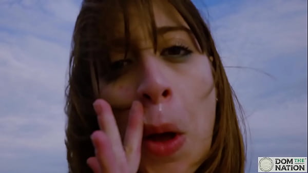 Italian babe Silvia Soprano worships her dominant's ass and feet as they walk along the rocks by the water -- except from a real domination session for Domthenation.com 