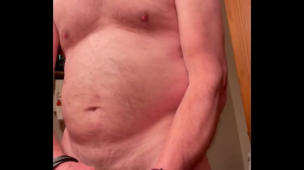 Gay daddy is horny, naked in the bathroom with a hard cock In his hand, stroking hard, he pumps out thick loads of sperm