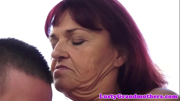 Redhead granny loves riding sweet young cock