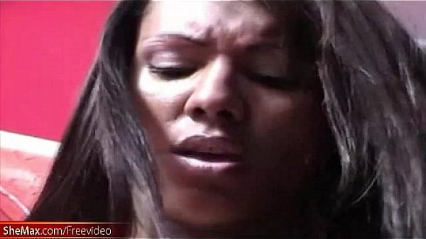 Black tranny with decent tits tugs her girl rod on red sofa