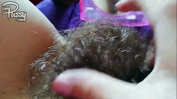 Amateur girlfriend with a hairy pussy masturbates opposite a mirror