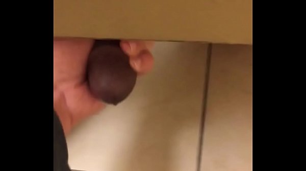 Jerking a big black cock in mall restroom
