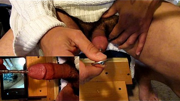 Solo-boy pushing a steel toy down his pee-hole.  