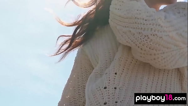 Petite brunette presents her perfect shapes on a trunk 