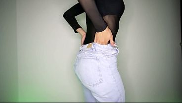 A sexy brunette with a skinny body shows off her assets. 