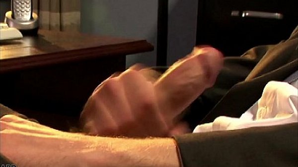 Elegant Sean Preston wanking his large cock at work