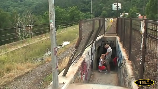 He fucks the blonde girl and cums in his mouth near the train tracks