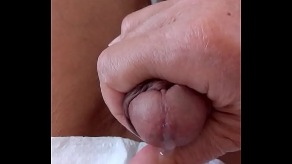 Quiet handjob on the couch 