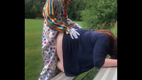 Clown fucks girl in soccer field