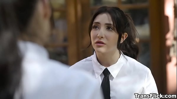 Two caterers caressing each other just out of view of their boss 