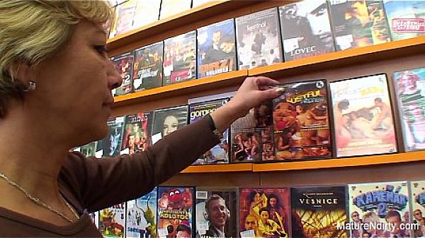 Granny fucks a guy in the video store