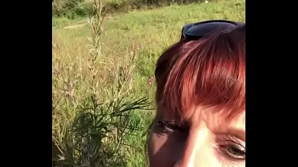 Milf gives a sensual blow job in public