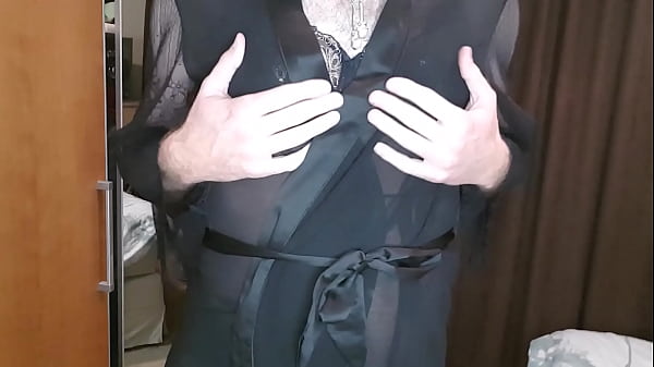 Man wearing black womans underwear and parading around in it.