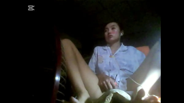 The camera under the table captured a beautiful woman at home alone and watching a porn movie.