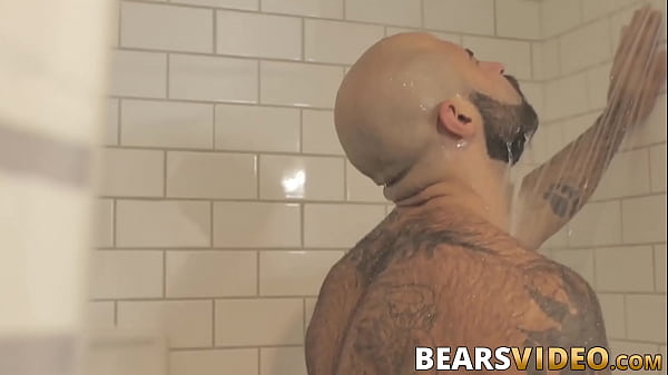 Hairy hunk jerks off solo in the shower 