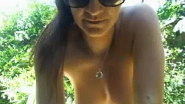 Chick Tanning And Rubbing Pussy