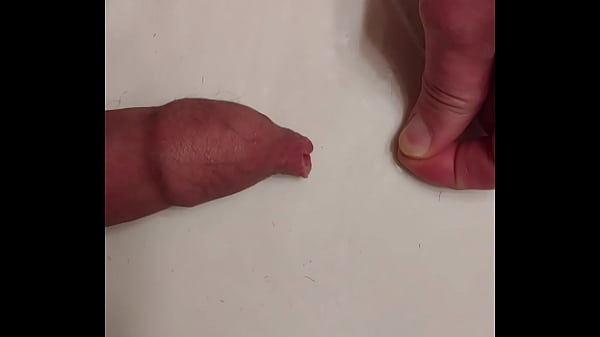 Playing with my soft long foreskin and stretching it