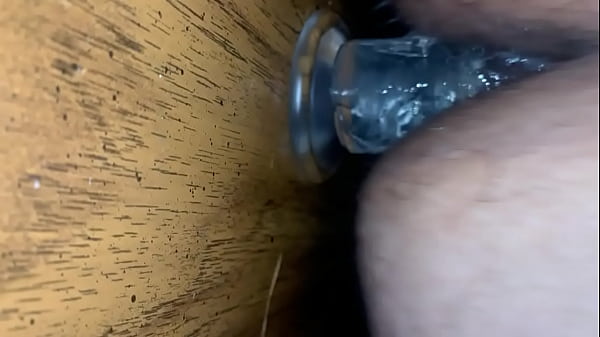Taking clear toy up the butt  