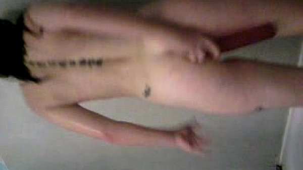 nikki dp'n her self with toys in the shower