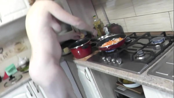 MILF naked woman continues to cook nude in kitchen 