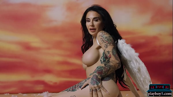 Curvy pornstar Joanna Angel wearing angel wings exposed her enhanced body