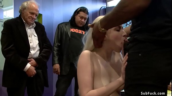 Pale blonde slave Ranie Mae made by mistress Princess Donna Dolore suck big black cock to John Johnson and some stranger in crowded public place
