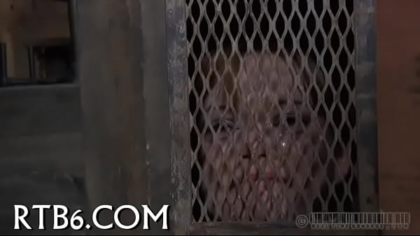 Angel is stripping inside cage  