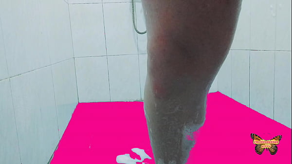 White ladyboy masturbates under shower wet cock with a shampoo 