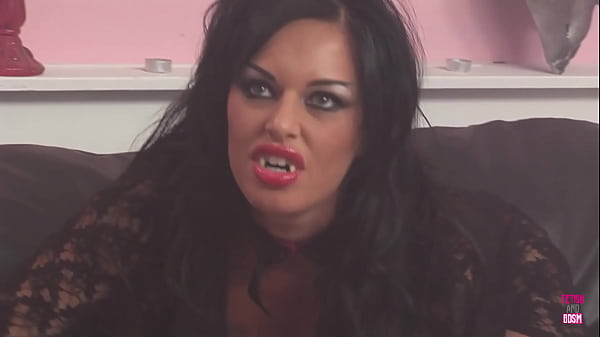 A vampire with a voluptuous physique engaged in a sexual encounter with a lesbian of Caucasian descent