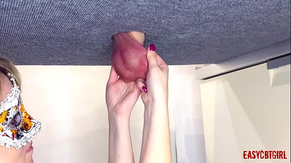 On the milking table, a dick with balls pulled back by a slut who loves when male genetics hang to the knee