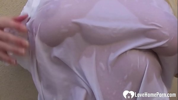 Once she got all wet from pouring water over her shirt, she stripped naked.