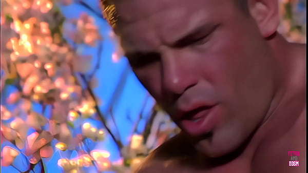 In a picturesque woodland, an attractive woman with dark hair engages in intense sexual activity with a muscular man adorned with tattoos