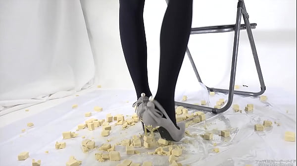Beautiful legs woman slams food with legs  