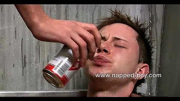 Brad Holt is tied and made to suck cock by Adam