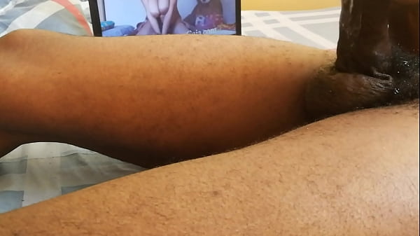 Black man Wanking on bed using the video of prof gaia