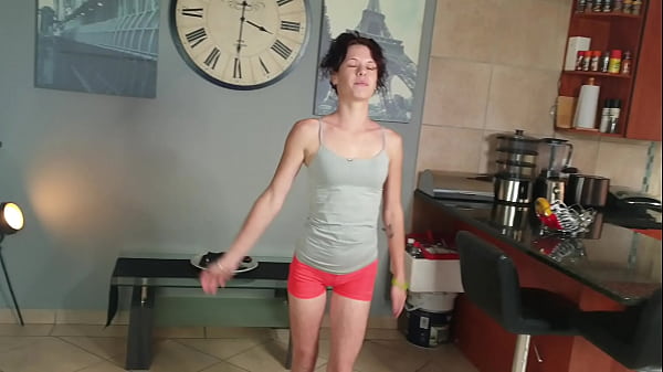 Skinny brunette urinating in pants while stretching