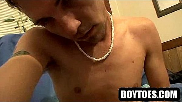 Hunk showing his feet while tugging on his hard cock 