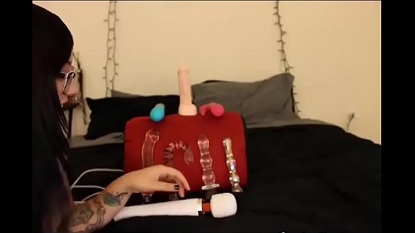 BBW brunette puts a glass dildo in her pussy  