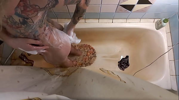 young guy taking a shower  