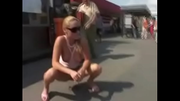 Blonde pee in street  