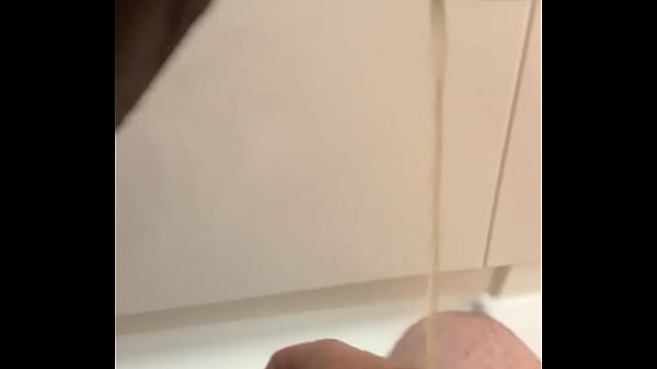 Peeing on his dick 