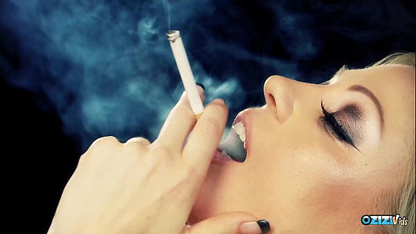 Awesome babes love making out while smoking cigarettes on the sofa