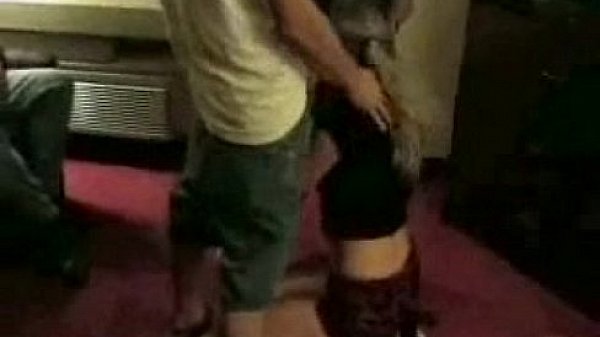 Nice girl giving a blowjob at a party