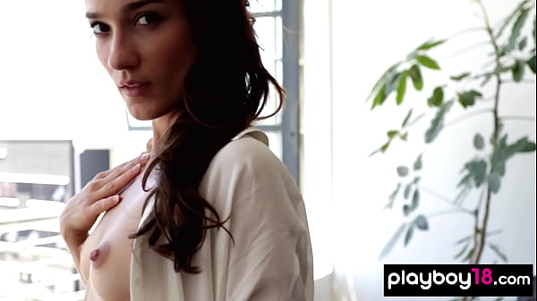 Skinny brunette european naked babe posing in her couch