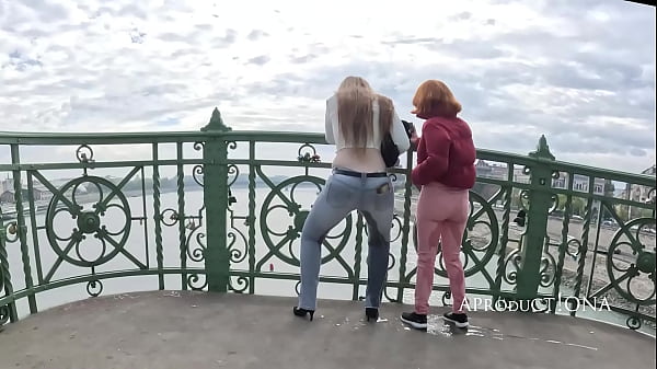 Wetting in their Jeans together on the bridge